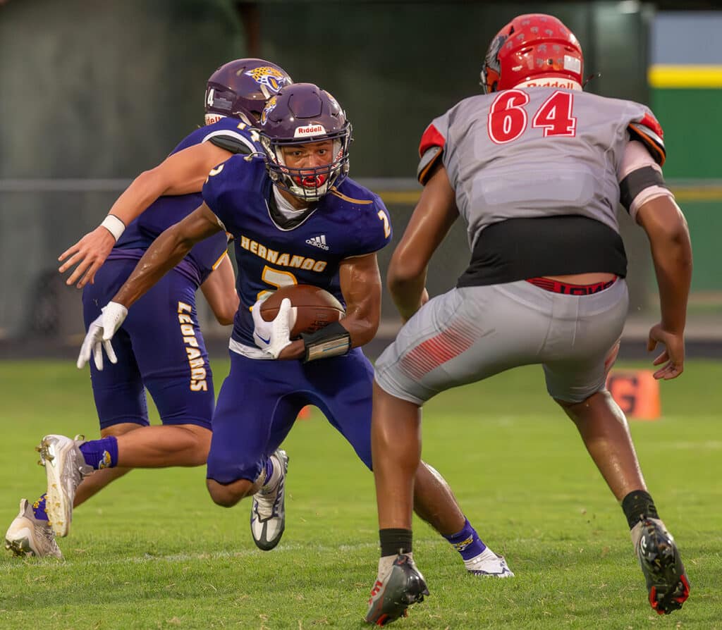 Hernando High,2, Gabe Sansone looks for a way around Clearwater High defender,64, Maurice Bryant. Photo by JOE DiCRISTOFALO