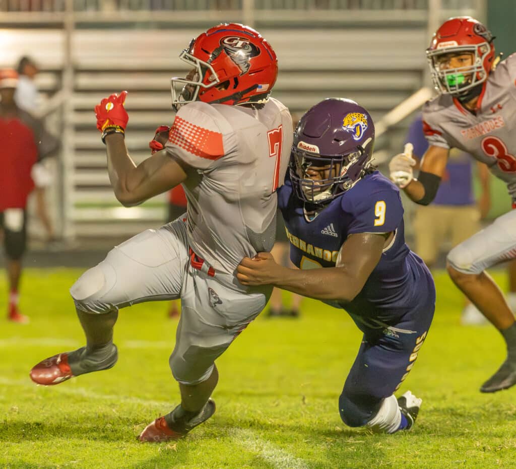 Hernando High’s ,9, John Capel III, brings down Clearwater High’s ,7, Ti’lan McGee during Friday nights home preseason game. Photo by JOE DiCRISTOFALO