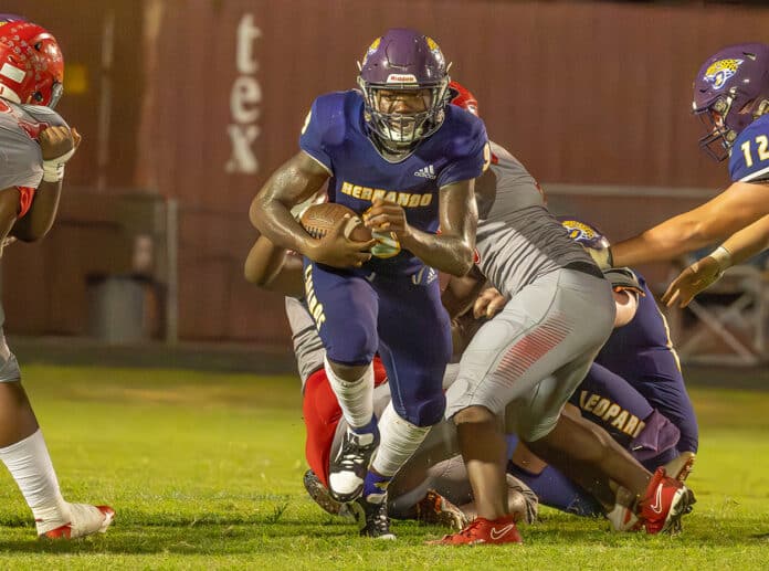 Hernando High’s ,9, John Capel III, finds a hole in the Clearwater High defense during Friday nights home preseason game. Photo by JOE DiCRISTOFALO﻿