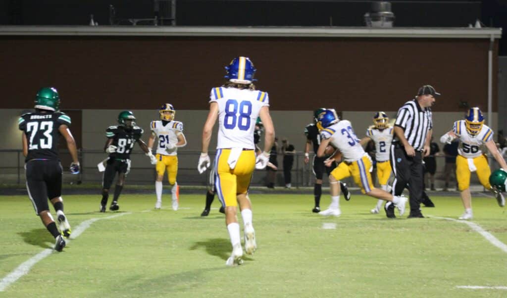 Crystal River's No. 33 Landen Ragan on his was to the end zone on Friday Aug. 25, 2023 against Weeki Wachee. Photo by Max Maglio.