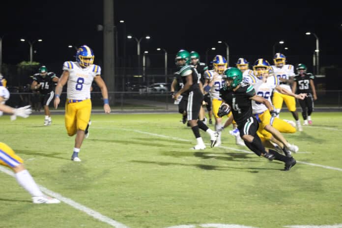 Weeki Wachee's No. 4 Adrian Cabezudo gains yardage against Crystal River, Friday Aug. 25, 2023.