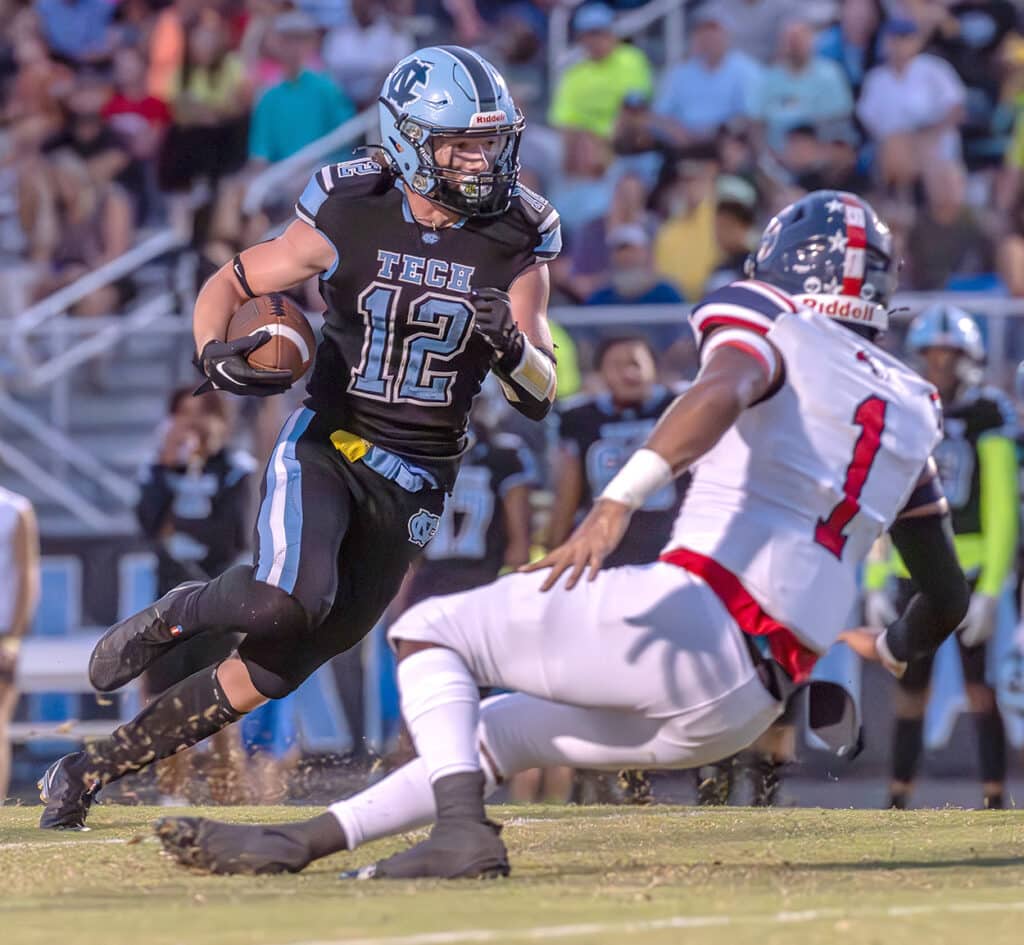 Nature Coast, 12, Connor Riggins cuts inside the pursuit by Springstead ,1, Derrick Chiarella Friday at Nature Coast. Photo by Joe DiCristofalo