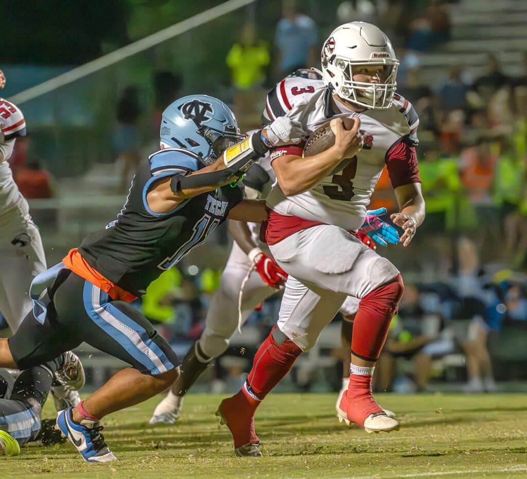 Springstead ,3, P.J. Class breaks this Nature Coast tackle on the way to an 18 yard touchdown. Photo by Joe DiCristofalo