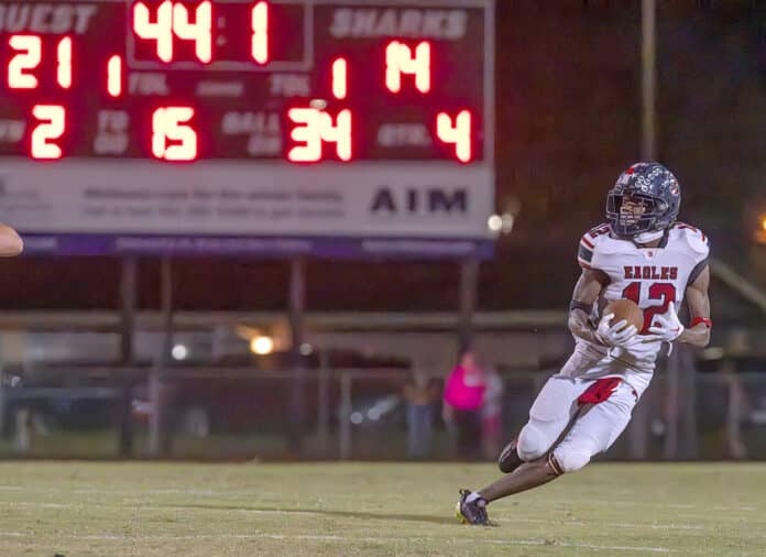 The scoreboard tells the tale as Springstead’s ,12, Cordarious Owens returns an intercepted pass to clinch the hard fought game for the Eagle’s at Nature Coast. Photo by Joe DiCristofalo