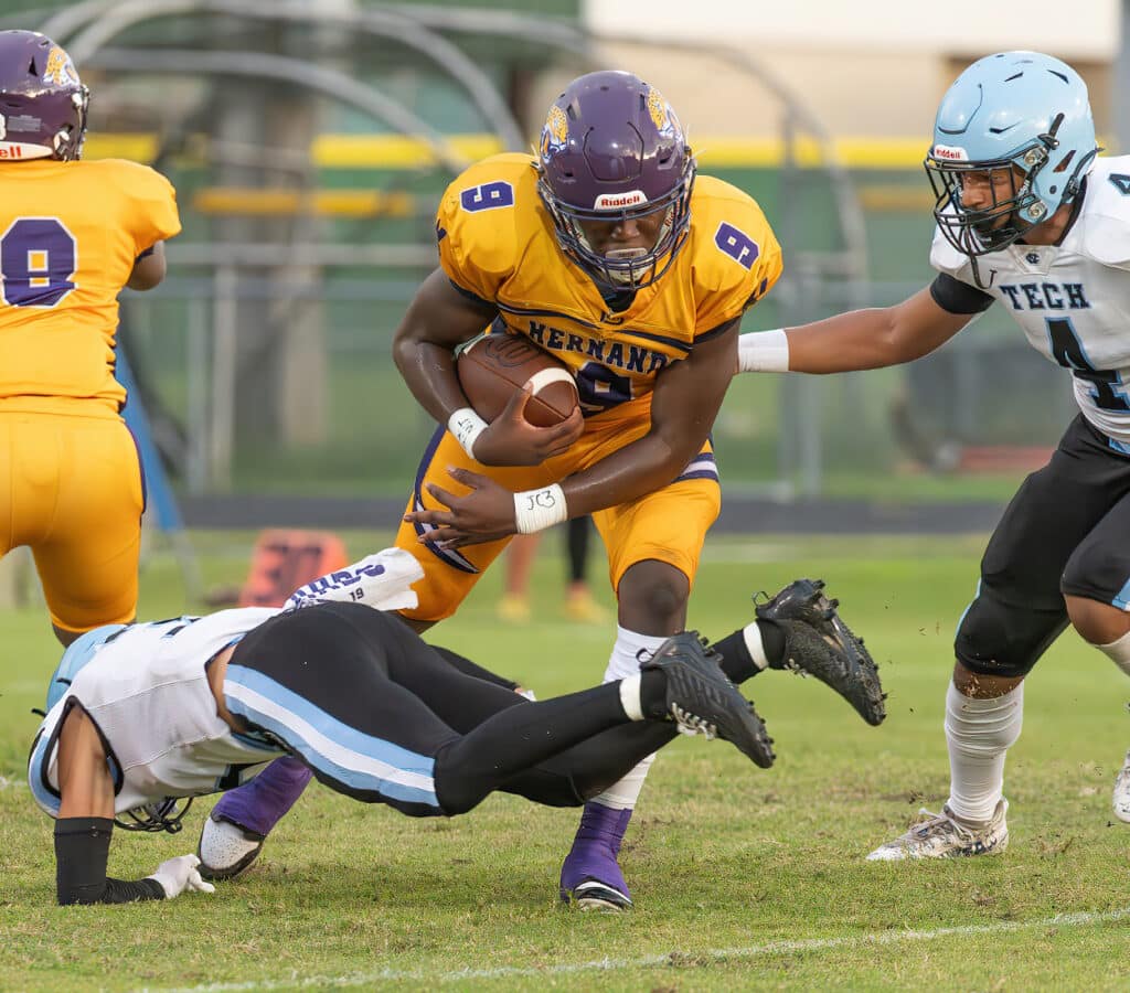 Hernando High, 9, John Capel III finds some room for a gain early in the match up between the Leopards and Nature Coast at Tom Fisher Stadium. Photo by JOE DiCRISTOFALO