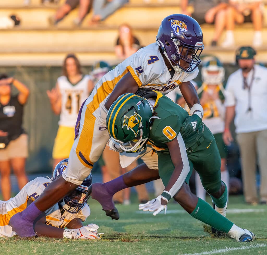 Hernando High’s, 4, Leandre Wright stops Lecanto, 0, Tex Joseph for a loss Friday in Lecanto. Photo by Joe DiCristofalo 9/22/23.