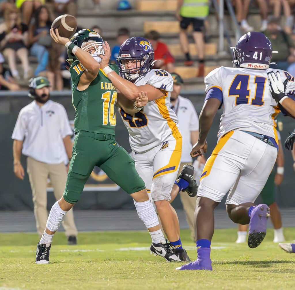 Hernando High’s 45, Colton Ashworth, disrupts a pass attempt by Lecanto High’s ,10, JT Tipton. The play resulted in an interception for the Leopards. Photo by Joe DiCristofalo 9/22/23.
