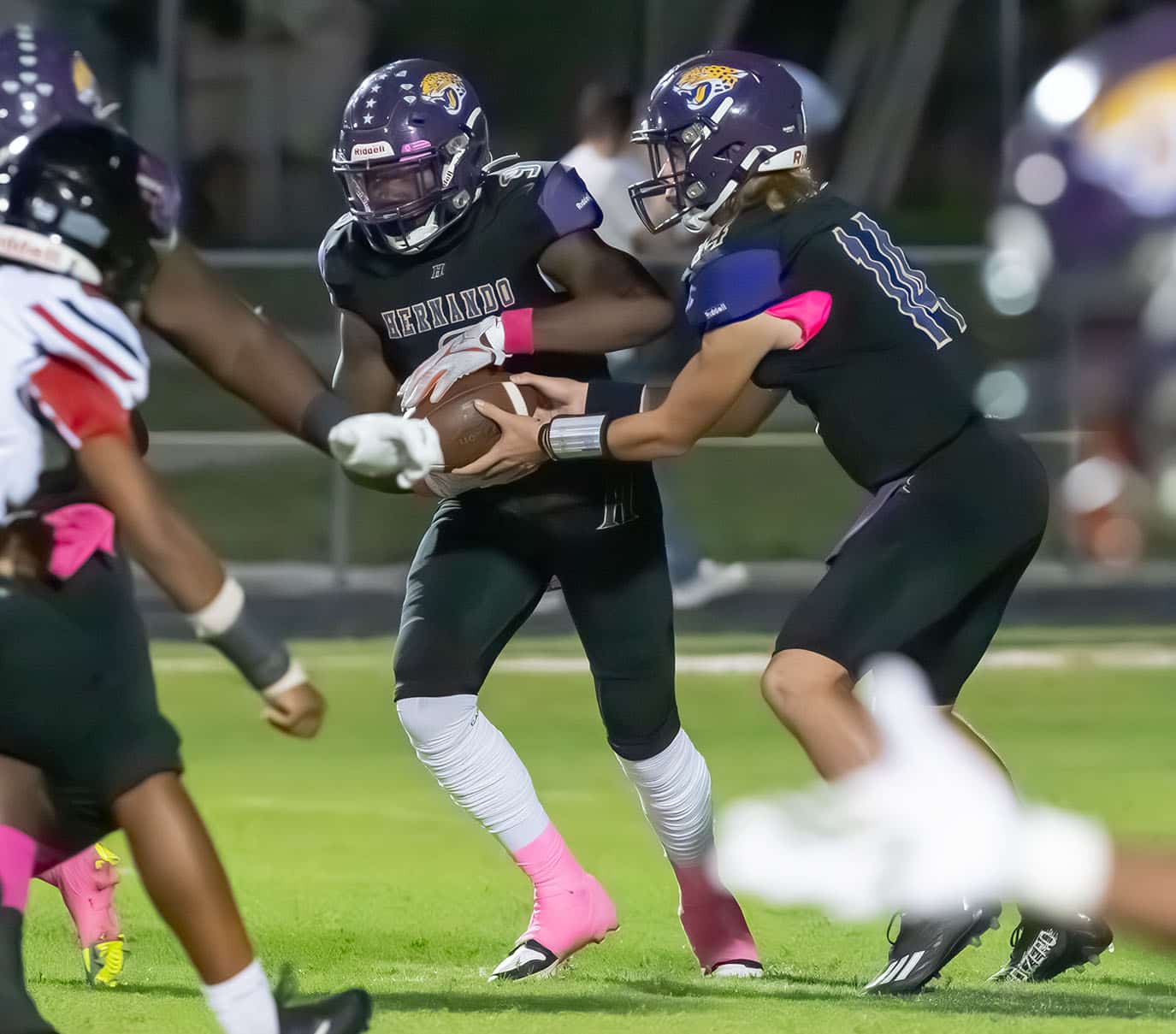 Hernando High QB, Michael Saltsman hands off to John Capel III during the game versus visiting South Sumter on 10/13/23. Photo by Joe DiCristofalo