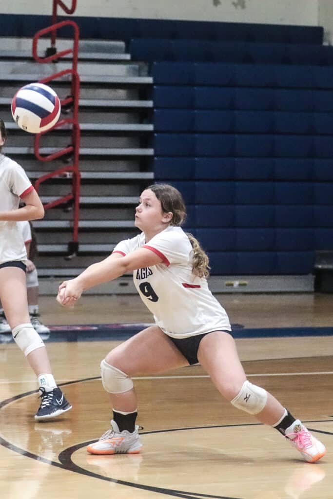 Eagles' #9 Fr. Kiersten Caamano returns volley back to the Pinellas Park Patriots in the District Playoff Monday night Oct. 16, 2023. [Credit: Cheryl Clanton]