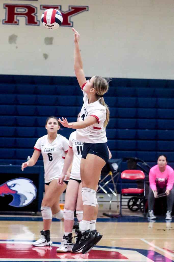 Monday night October 16,2023 at the Stead Eagles' #4 So. Sylvia Hatfield slams ball back to the Patriots in District Playoff. [Credit: Cheryl Clanton]