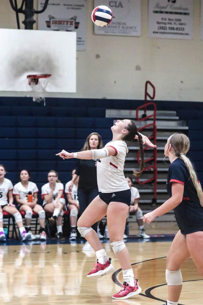 Girls Volleyball District Tournament Playoff Monday night Oct. 16, 2023 at Springstead. Eagles' #12 Sr. Emily Miller returns ball back to the Patriots. [Credit: Cheryl Clanton]