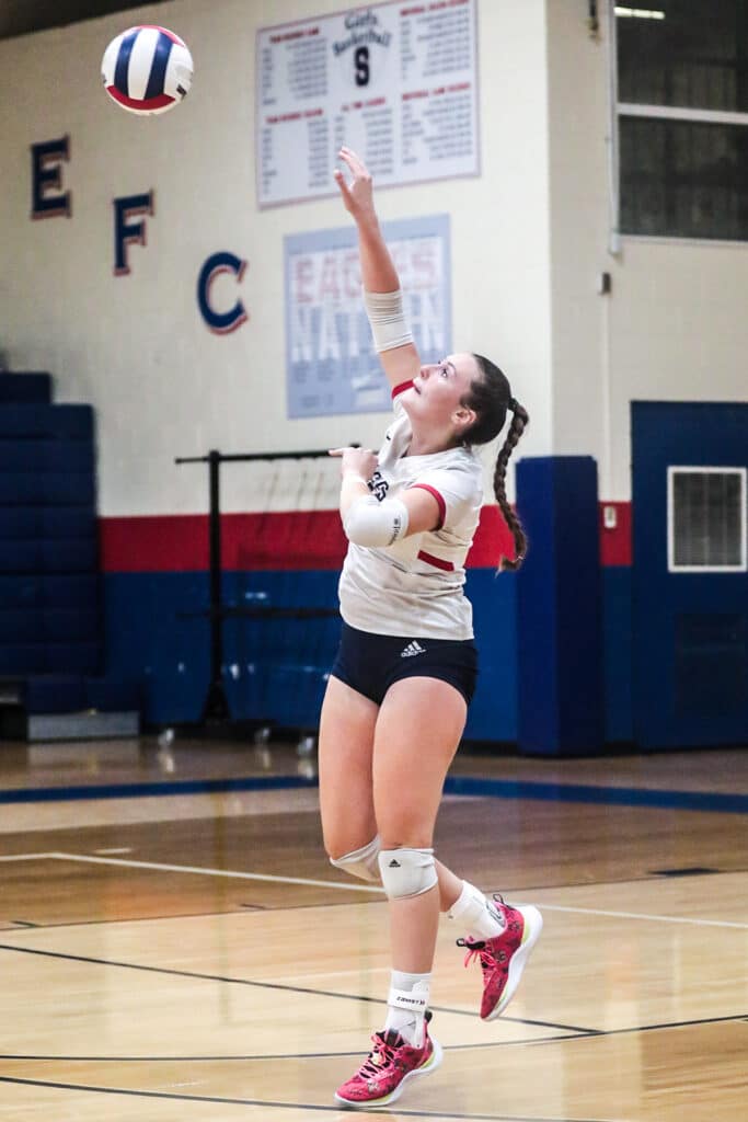 Monday night October 16,2023 at the Stead Eagles' #12 Emily Miller slams ball back to the Patriots in the District Playoffs. [Credit: Cheryl Clanton]