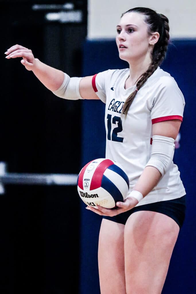 Monday night October 16,2023 at the Stead Eagles' #12 Emily Miller ready to serve ball against the Patriots in District playoffs. [Credit: Cheryl Clanton]