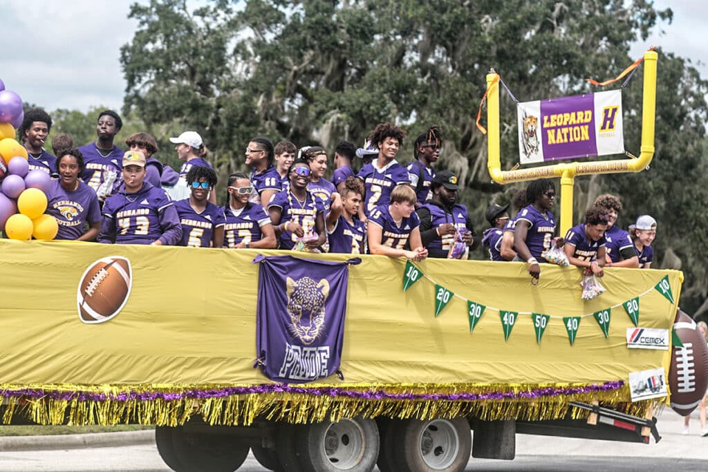 2023 HHS Homecoming Parade  Two trailer fulls of Leopard Football Players.  [Credit Cheryl Clanton]