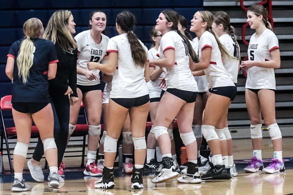 Excitement at Springstead Girls Volleyball Distict Playoff against the Pinellas Park Pirates. Eagles Coach Andrea Gracey sings with her team while on break. [Credit: Cheryl Clanton]