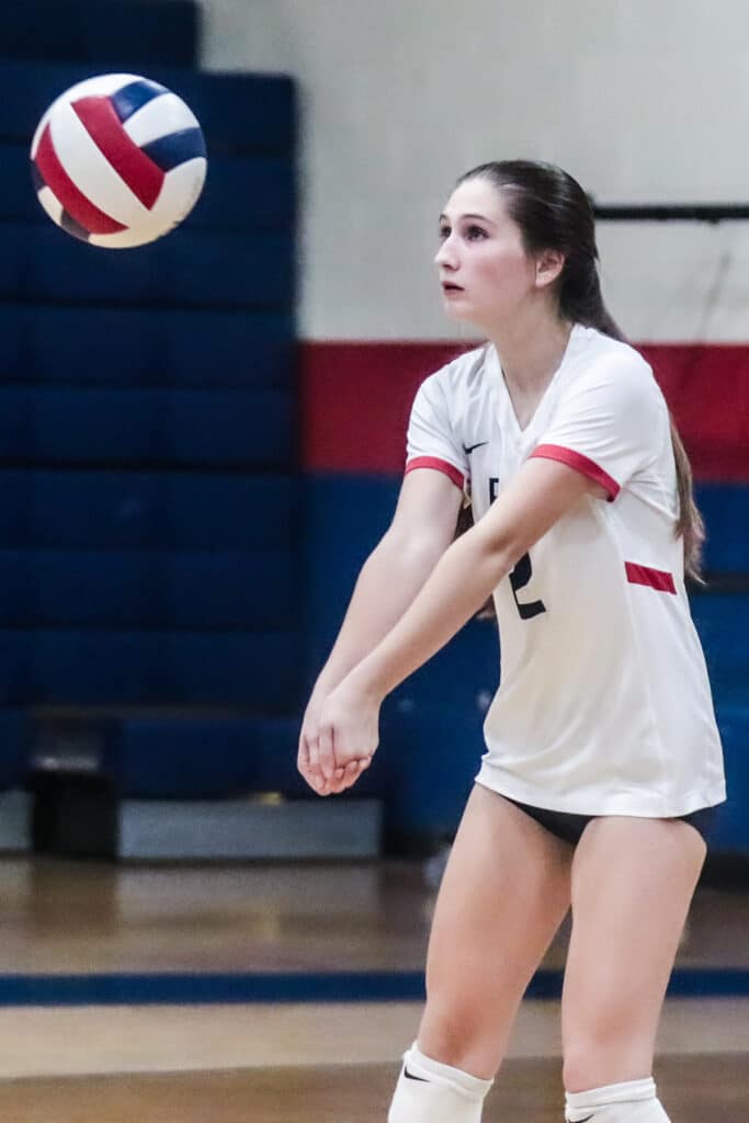 Eagles' #2 Jr. Savannah Imhof returns volley back to the Pinellas Park Patriots in the District Playoff Monday night Oct. 16, 2023. [Credit: Cheryl Clanton]