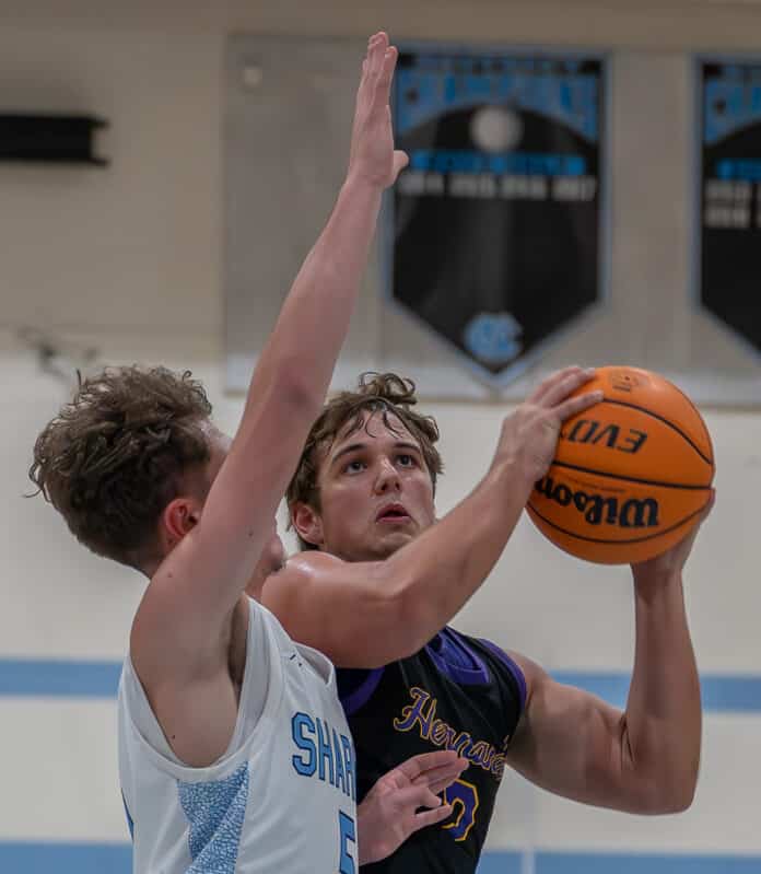 Hernando High's, 2, Sam Jacksonn works against Nature Coast ,5, Jacob McPhail on the way to the basket Tuesday at NCT. Photo by Joe DiCristofalo