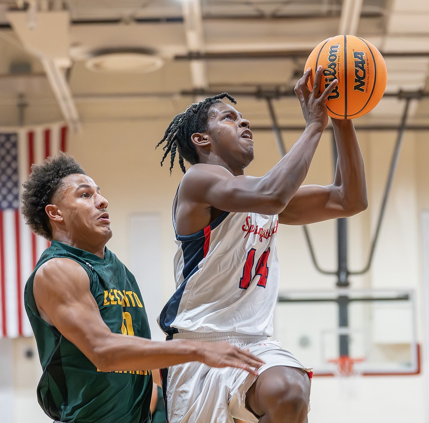 Springstead High's ,14, Zion Mckenzie drives past Lecanto High’s ,0, Caden Moore for a layup Tuesday at Springstead High. Photo by Joe DiCristofalo