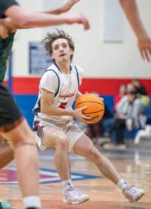 Springstead High's ,5, Ryan Sayre eyes the basket while maneuvering through the defense in Tuesday night’s match against visiting Lecanto High. Photo by Joe DiCristofalo