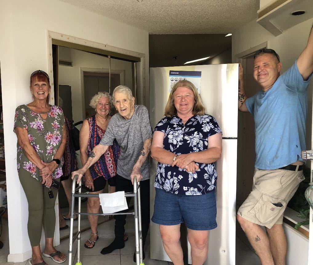 Robert Vannattan with his new refrigerator. [Photo provided by Maryann Gunn]