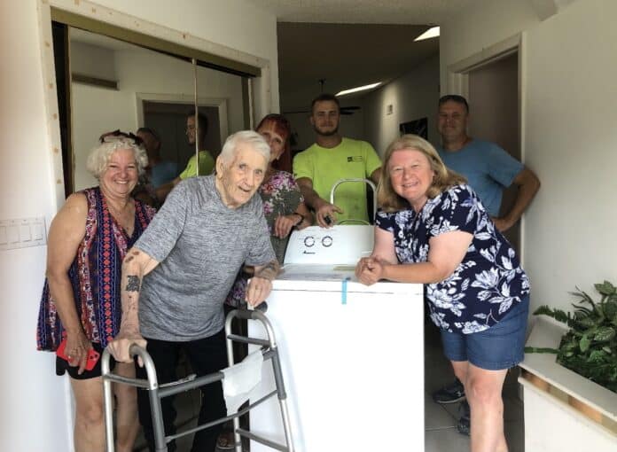 Robert Vannattan and his new washing machine. [Photo provided by Maryann Gunn]