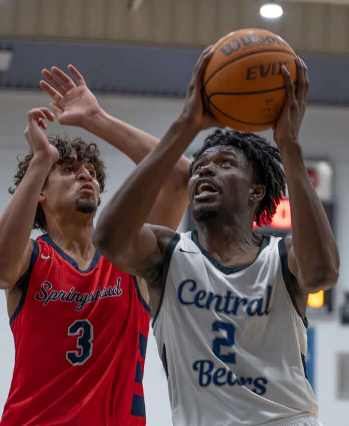 Central High, 2, Jeroen Watson eyes the basket while guarded by Springstead High, 3, Nick Cordero Tuesday night at Central High. Photo by Joe DiCristofalo