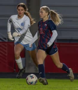 Springstead High, 21, Sarah Frazer handles the ball near midfield marked by Nature Coast Tech, 20, Peyton Cheze. Photo by Joe DiCristofalo