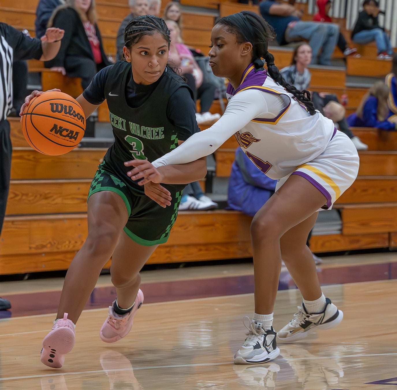 Weeki Wachee, 3, Joelys Rodriquez drives the lane while defended by Hernando high, 21, Tyrah Gary Tuesday in Brooksville. Photo by Joe DiCristofalo