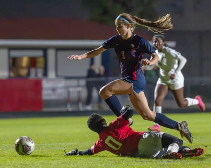 Springstead High, 1, Lauren Anderson eludes Buchholz High goalkeeper Mimi Fisher, but the ensuing scoring attempt missed during the 6A District 4 semi-final game in Spring Hill. [Photo by Joe DiCristofalo]