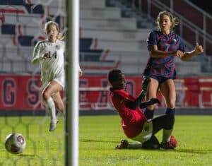 Springstead High, 7, Ava Kanaar  gets a shot past Buchholz High goalkeeper Mimi Fisher. Kanaar scored six times in the 8-0 Eagle win in the 6A District 4 semi-final game in Spring Hill. [Photo by Joe DiCristofalo]