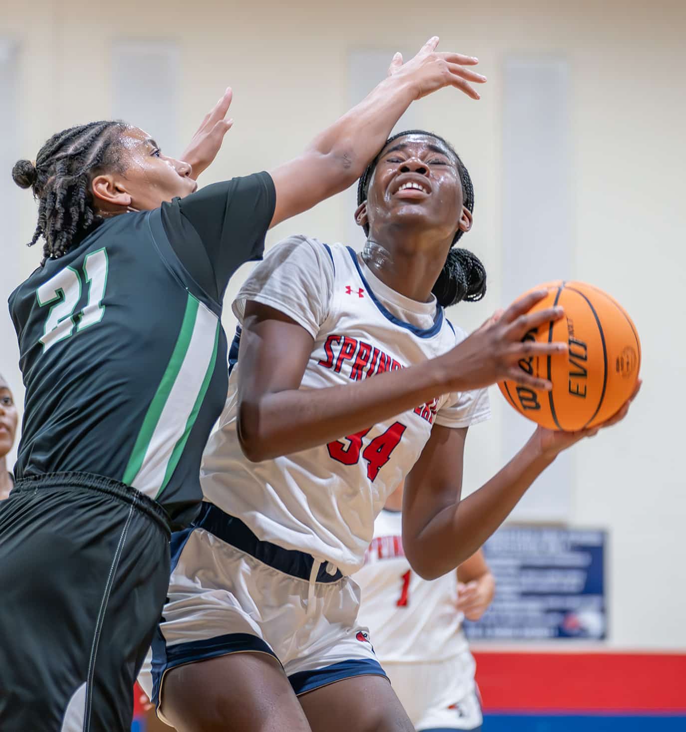 Springstead High, 34, Melanie Francis works against tight defense by Gulf High’s ,21, Ariana Rodriguez in the Springstead Holiday Tournament. [Credit: Joe DiCristofalo]