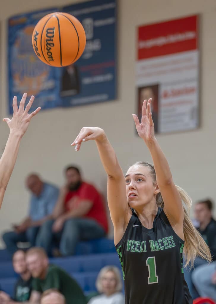 Paige Atwater, puts up a three point basket in the game with Gulf High in the Springstead Holiday Tournament. [Credit: Joe DiCristofalo]