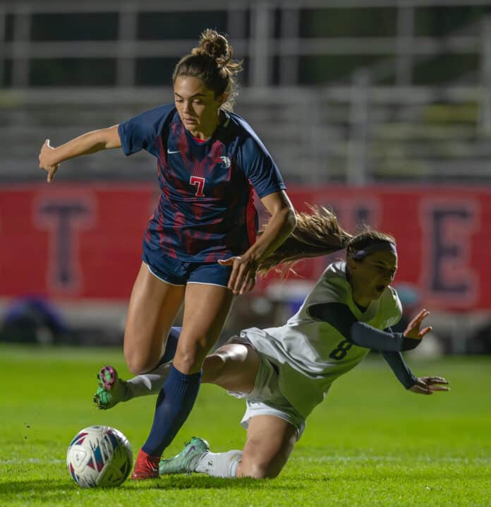 Springstead High’s ,7, Ava Kanaar works past the defense by Hernando High’s ,8, Skyla McCorts in a home match Wednesday. Photo by Joe DiCristofalo