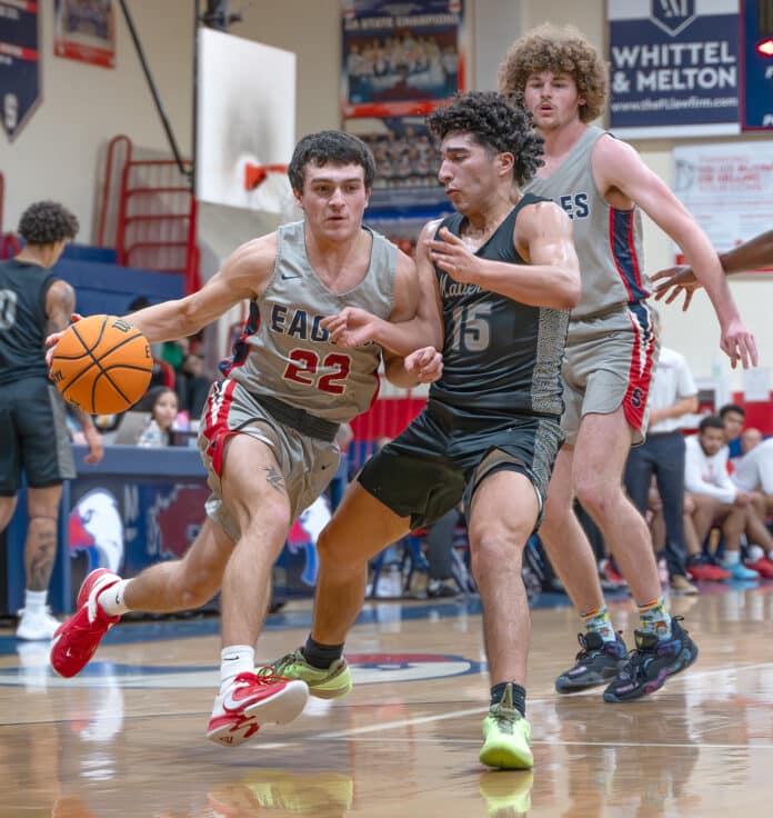 Springstead High’s, 22, Adrian D’Acunto heads to the basket defended by Archbishop McCarthy’s, 15, Enrique Duboy in the semifinal match at the Glory Days Greg O’Connell Holiday Shootout. Photo by Joe DiCristofalo