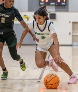 Weeki Wachee High’s ,3, Joelys Rodriguez tries to drive past a Villages Charter School defender Thursday at a game held at Winding Waters Middle School. Photo by Joe DiCristofalo