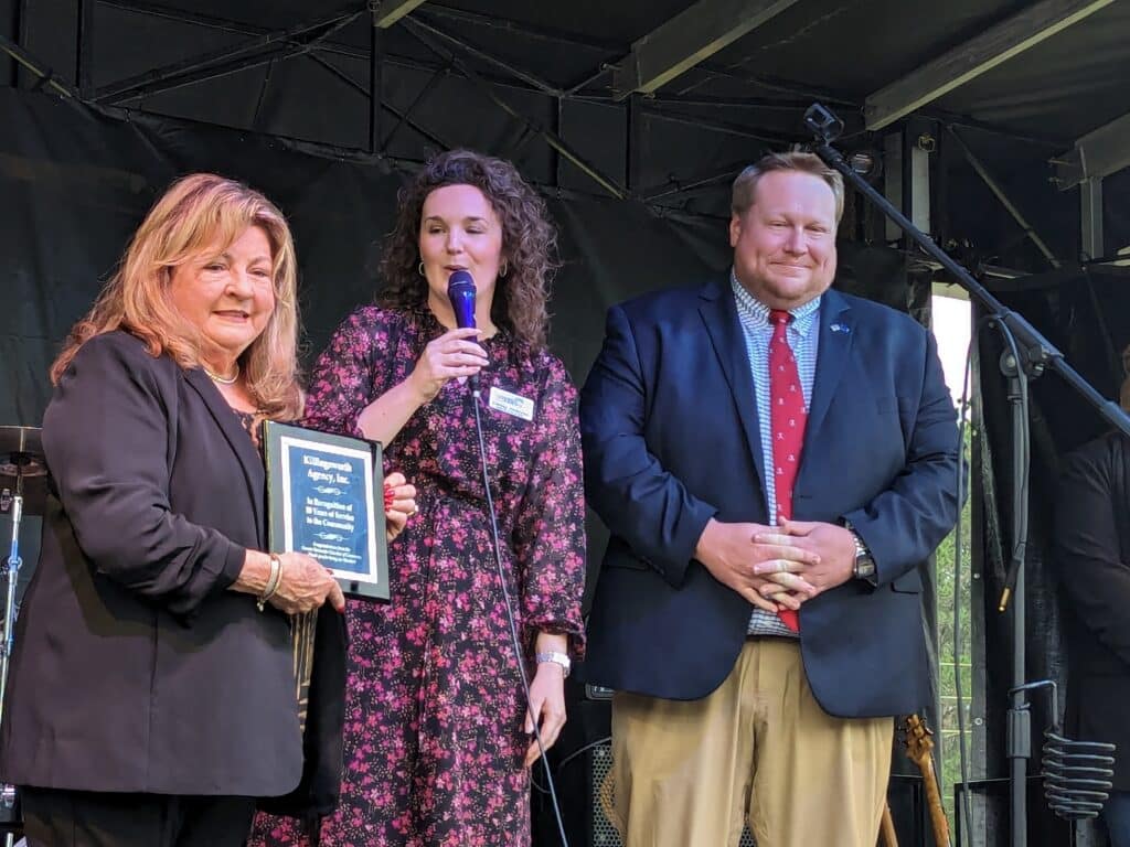 Dianne Waldron, President of Killingsworth Insurance accepts a plaque from GHCCC CEO Ashley Hofecker and Executive Board of Directors Chairman Jared Tanner.