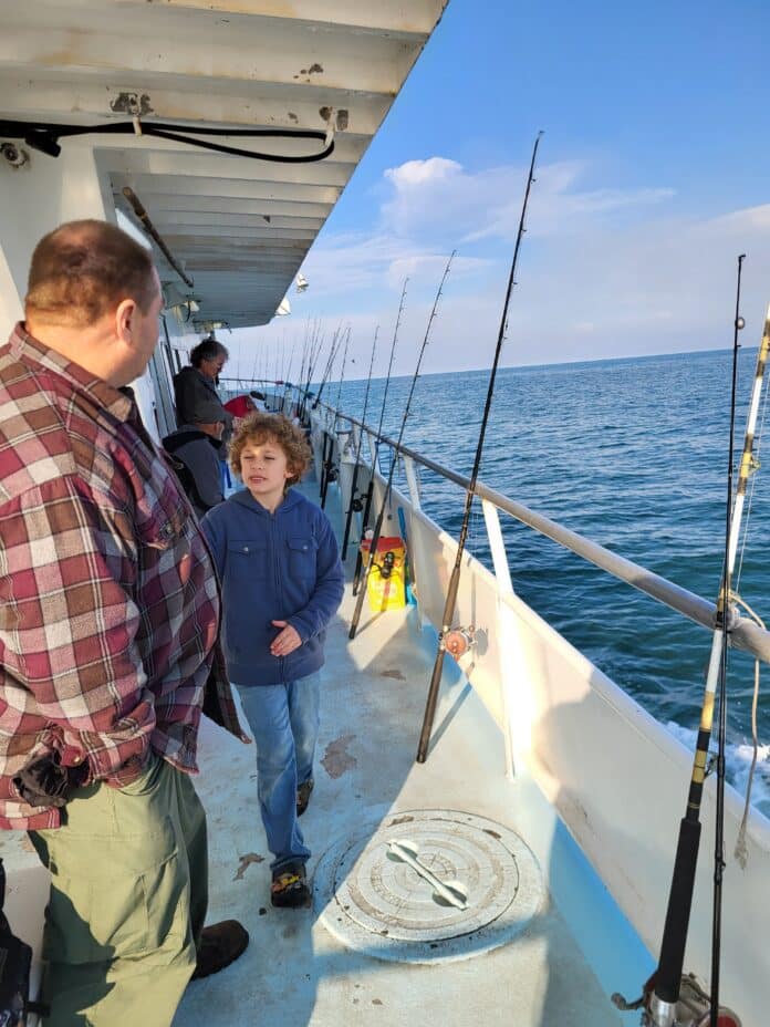 John Weipz and his grandson Dominick on the Two Georges fishing boat out of Tarpon Springs. [Courtesy Photo]