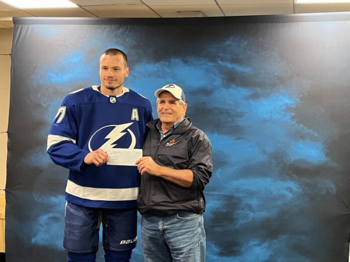 Victor Hedman, alternate captain for the Tampa Bay Lightning presents Mark Barry, CEO of The Arc Nature Coast with a donation of $50,000. Photo courtesy of Tampa Bay Lightning.