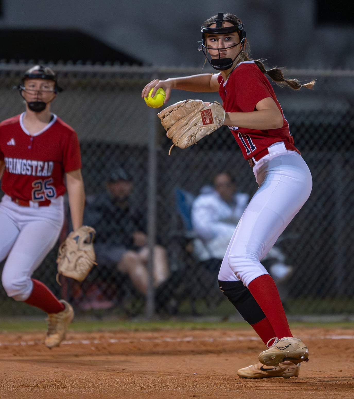 Springstead pitcher, Ava Miller throws to first base Tuesday night in the game with visiting Weeki Wachee High. [Photo by Joe DiCristofalo]