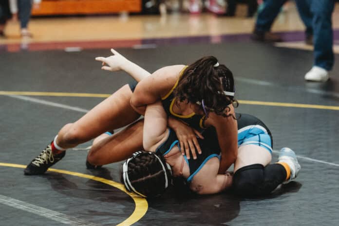 Emma Bauknight of Hernando works to get the pin against Jerry Giddens from Nature Coast. [Photo by Cynthia Leota]