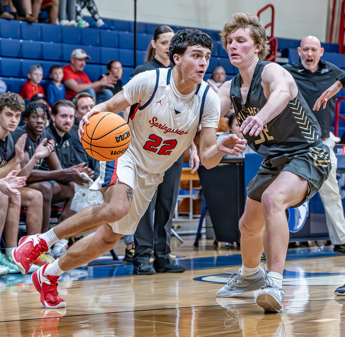 Springstead, 22, Adrian D’Acunto drives past Mitchell High, 32, Brock Peterson in the Eagles 6A Division 4 playoff win Tuesday evening at Springstead High. [Photo by Joe DiCristofalo]