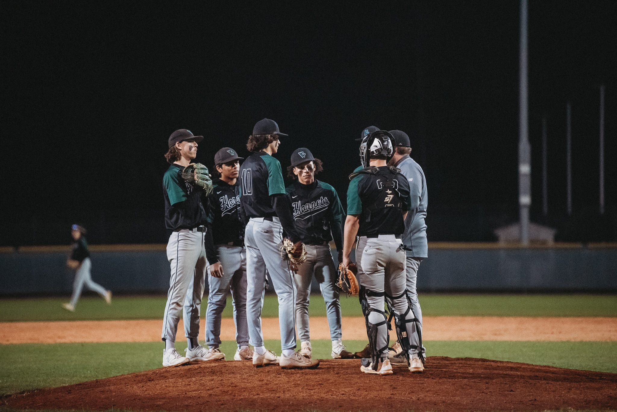 Weeki Wachee players convene on the mound. Credit: Cynthia Leota