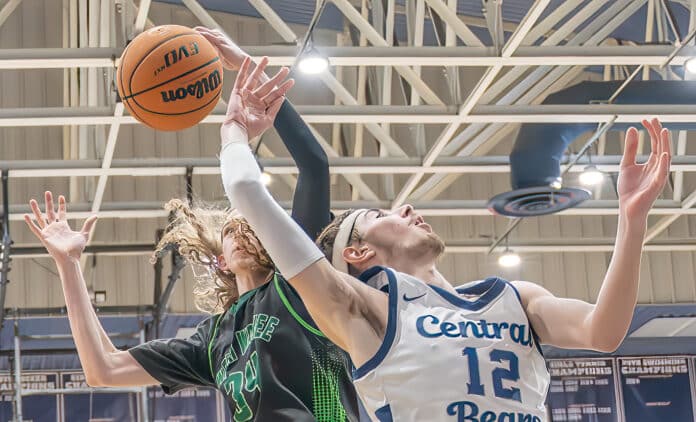 Weeki Wachee High, 34, Matthew Hazivasillis swats the ball away from Central High, 12, in the 4A District 9 semifinal at Central High Thursday night. [Photo by Joe DiCristofalo]