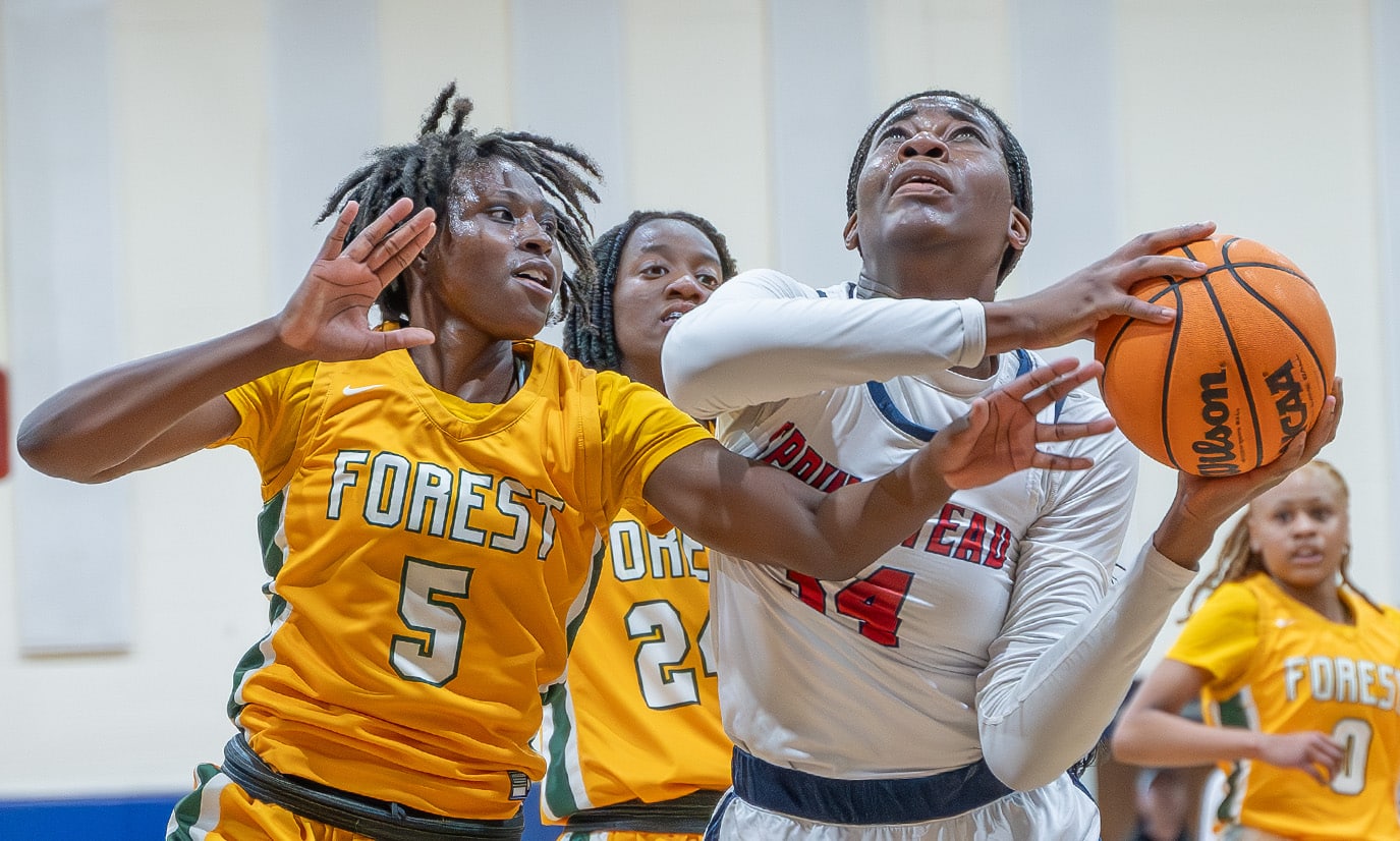 Springstead High School, 34, Melanie Francis works for a shot while defended by Forest High, 5, Janaina Wess in the 6A Division 4 Championship Game versus visiting Forest High. [Photo by Joe DiCristofalo]