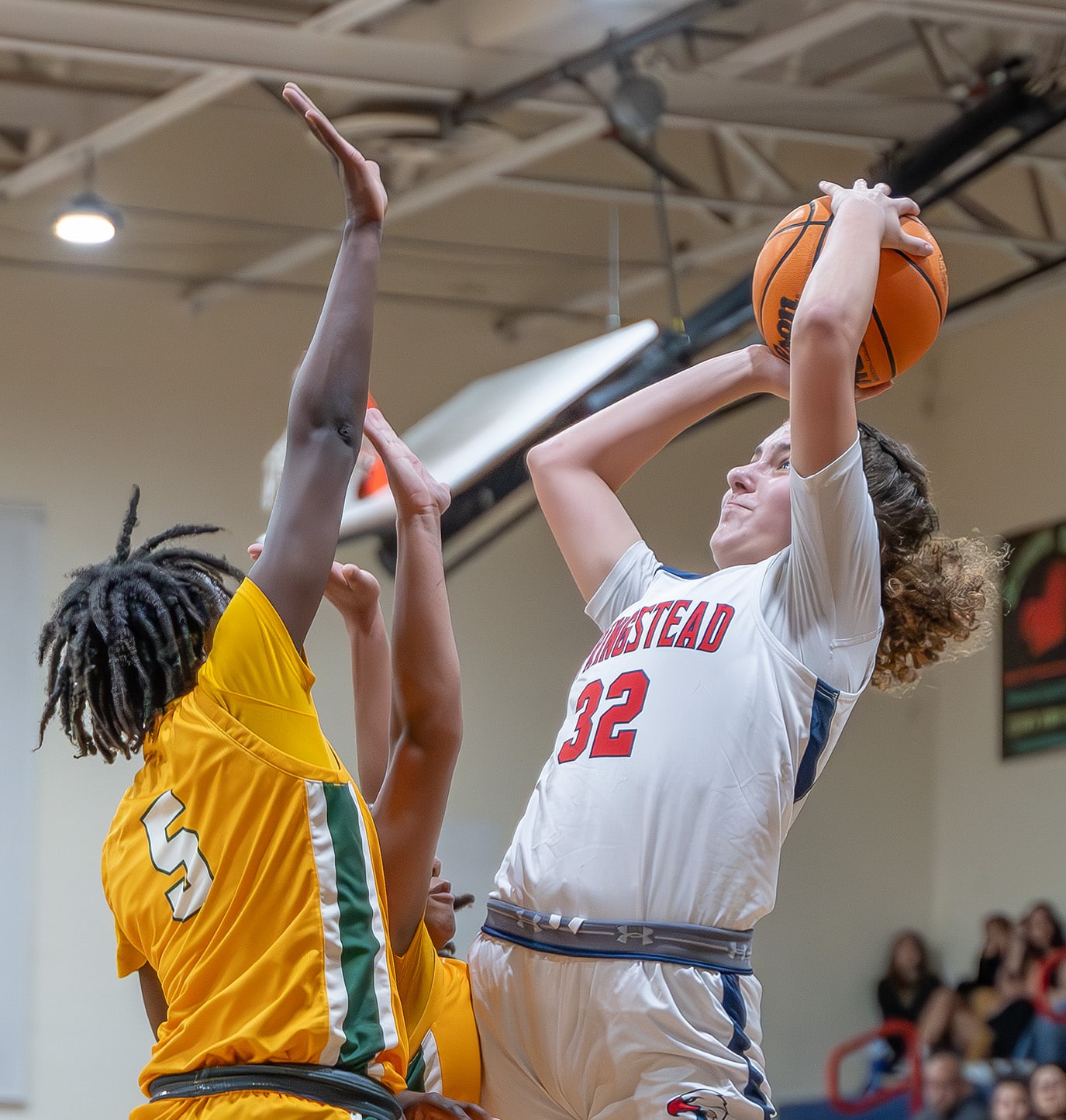 Springstead High School, 32, Addy Osborne shoots over Forest High, 5, Janaina Wess in the 6A Division 4 Championship Game versus visiting Forest High. [Photo by Joe DiCristofalo]