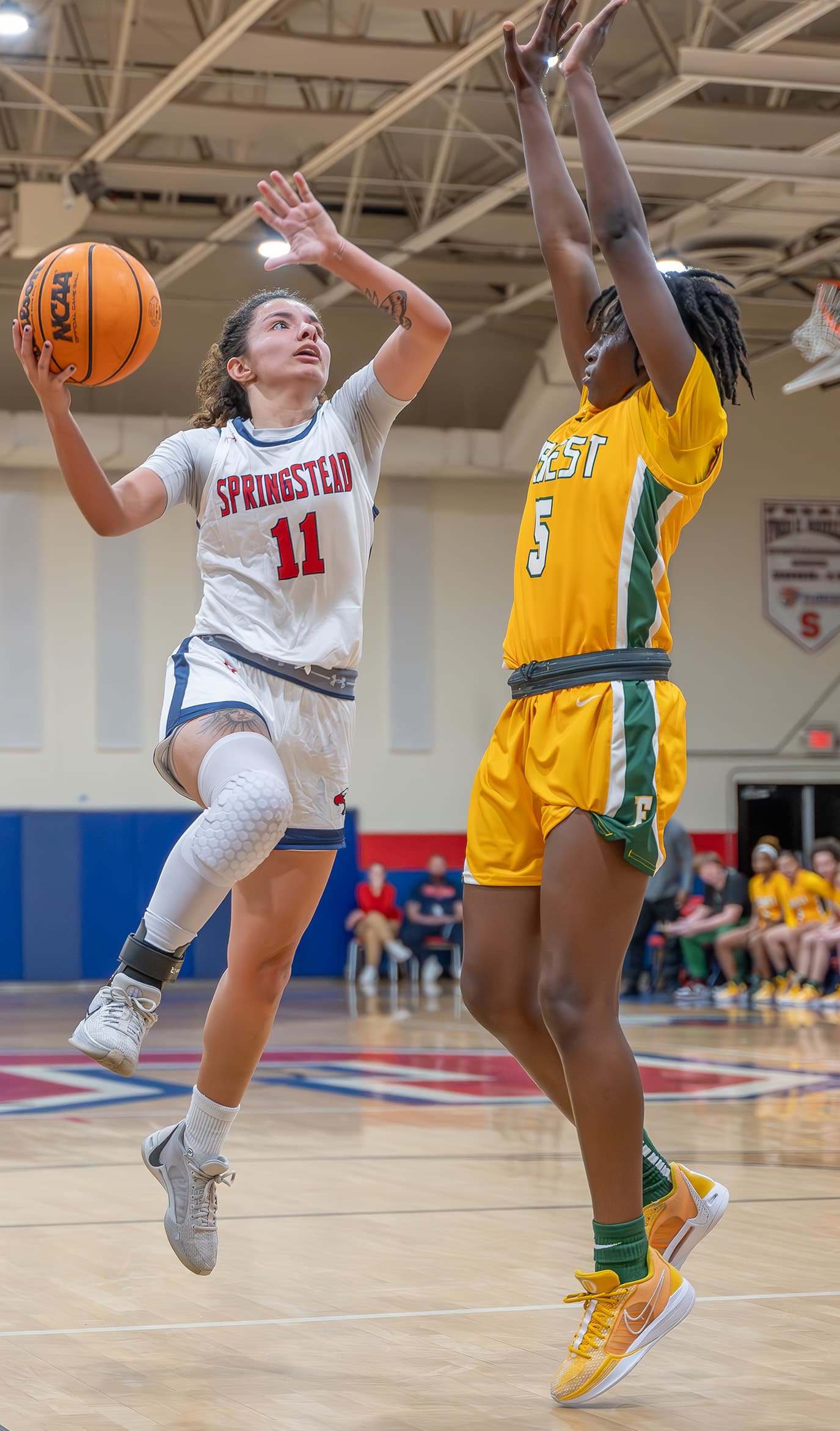 Springstead High School, 11,Samantha Suarez shoots over Forest High defender Janaina Wess ,5, in the 6A Division 4 Championship Game. [Photo by Joe DiCristofalo]