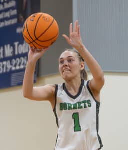 Weeki Wachee, 1, Paige Atwater launches a three-point shot in the 4A Region quarterfinal game versus Academy of The Holy Names held at Weeki Wachee High School. [Photo by Joe DiCristofalo]
