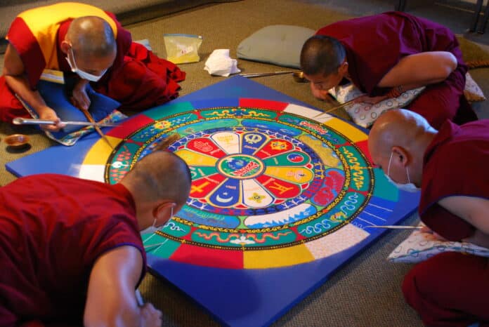 A “Peace” sand Mandela previously created by visiting Tibetan Sacred Arts Tour monks. A mandala of this size and intricacy takes 5-7 days to complete with multiple monks working on it for 5-6 hours a day.