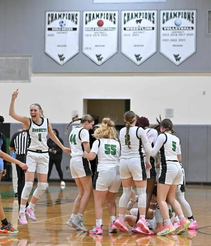 Weeki Wachee Hornets celebrate the district championship win. [Credit: Dan Brovont]