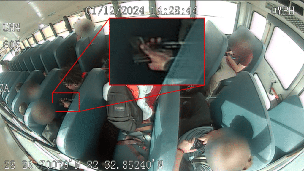 School bus footage of suspect holding a gun.